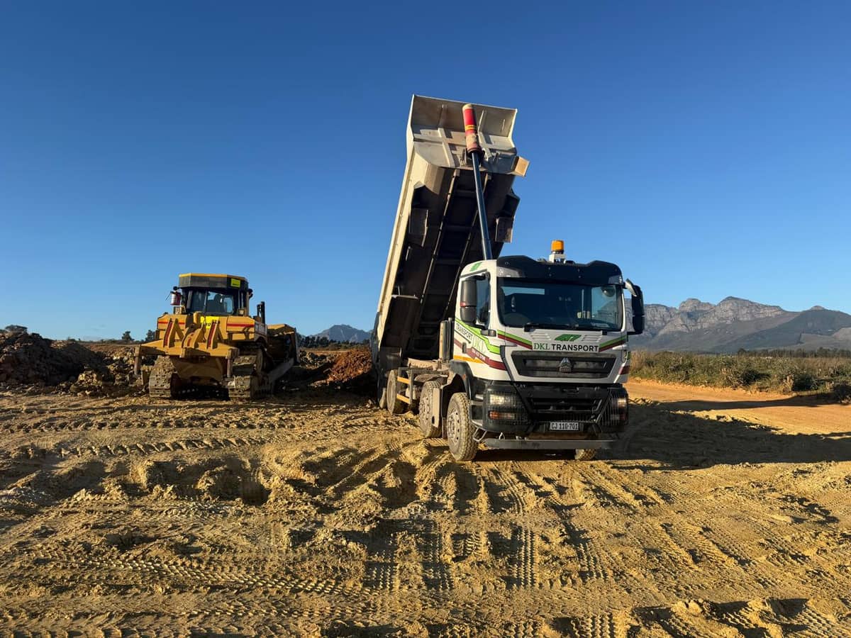 DKL Transport Sinotruk Howo tipper with mountain backdrop